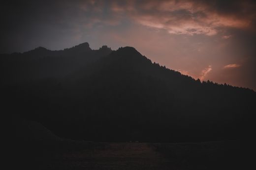 Mountain ridge silhouetted at dusk — Syed Qaarif Andrabi on Pexels