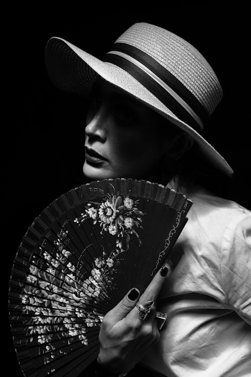 Woman with a Hat and a Fan