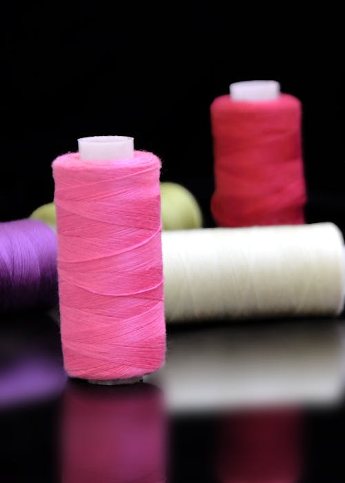 Colorful Threads on Black Background