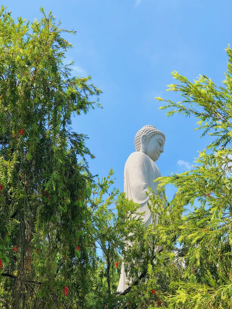 Blue Sky Over A Buddha Sculpture