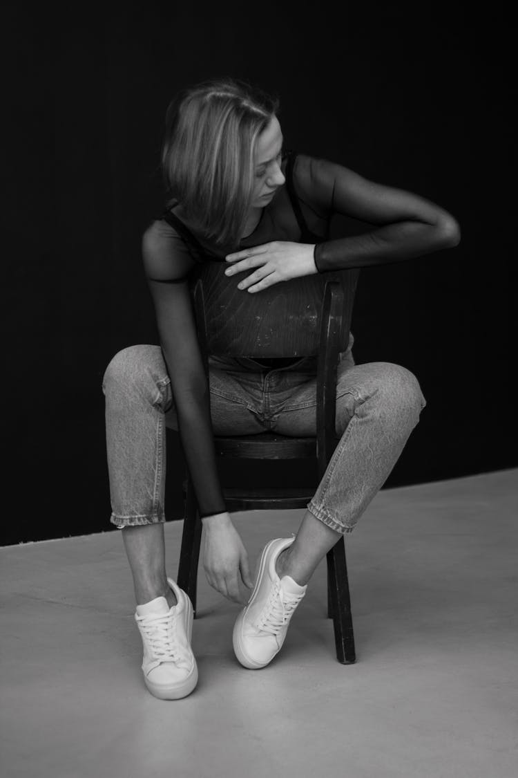 Woman Sitting In Studio On A Chair