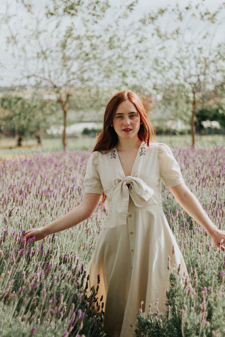 Redhead Woman In Dress Posing In Lavender Field