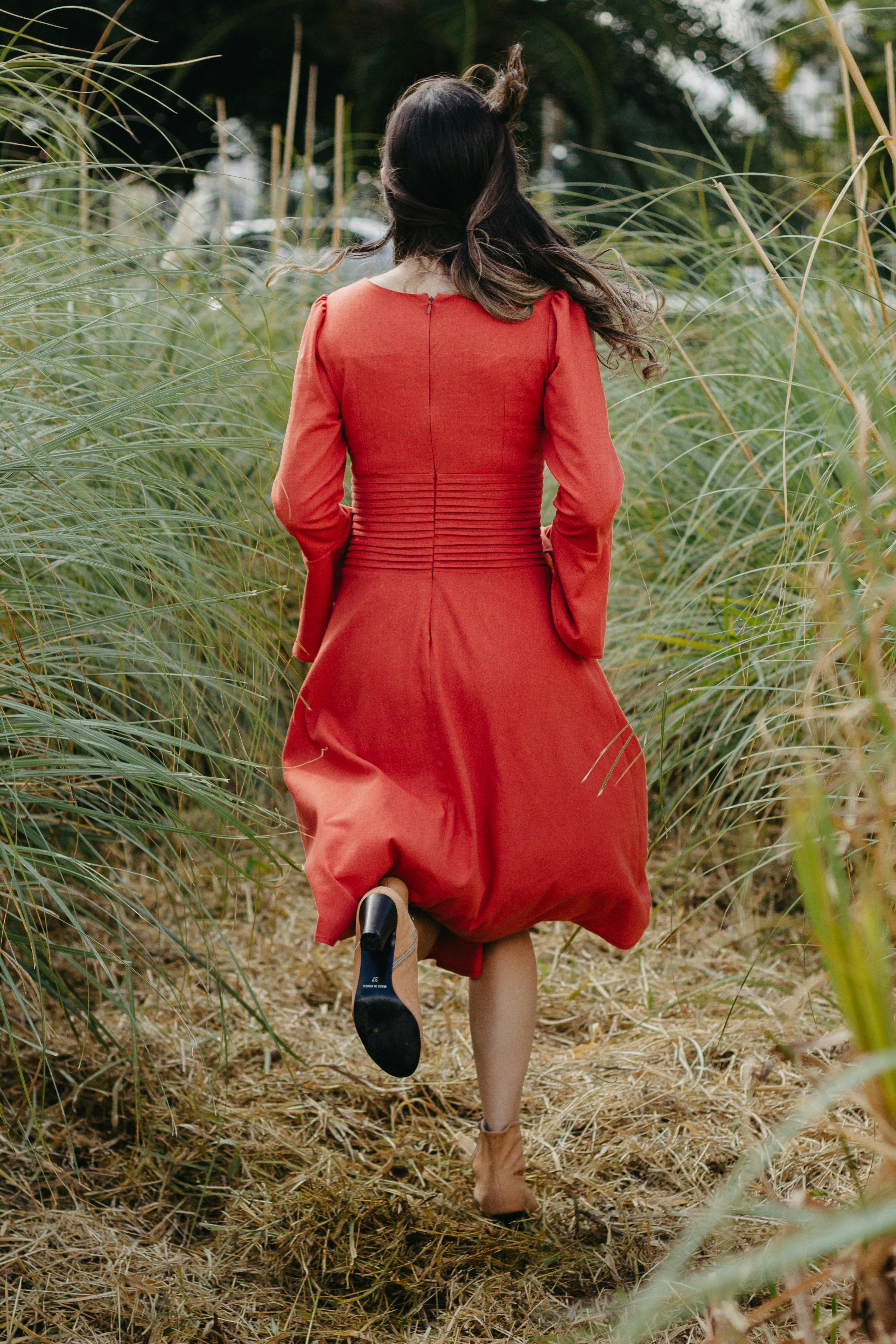 woman in red dress running