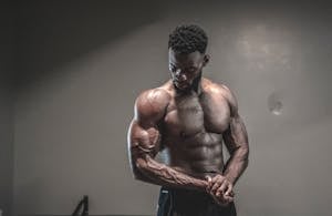 Confident male fitness member