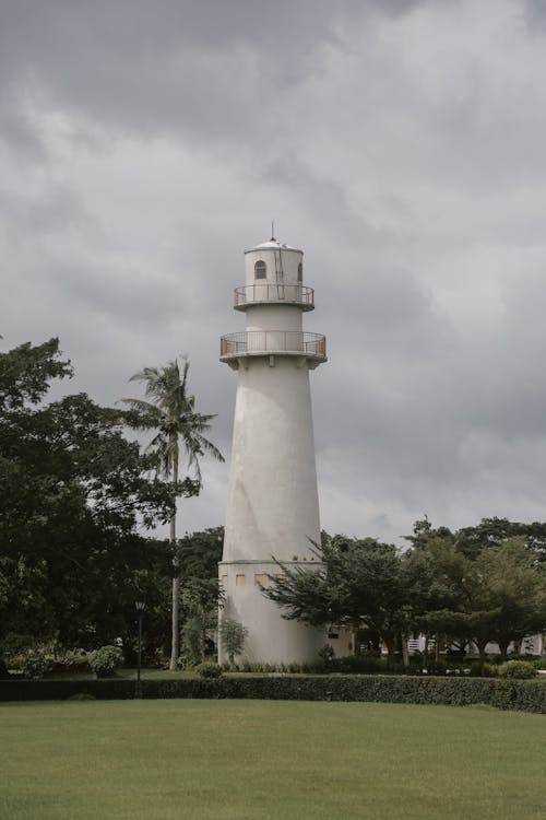 Free White Lighthouse and a Park  Stock Photo