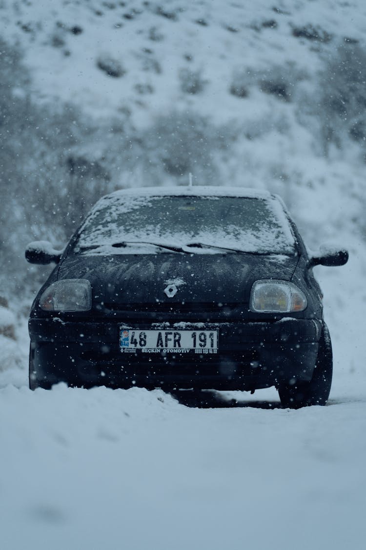 Car Driving In Winter Landscape