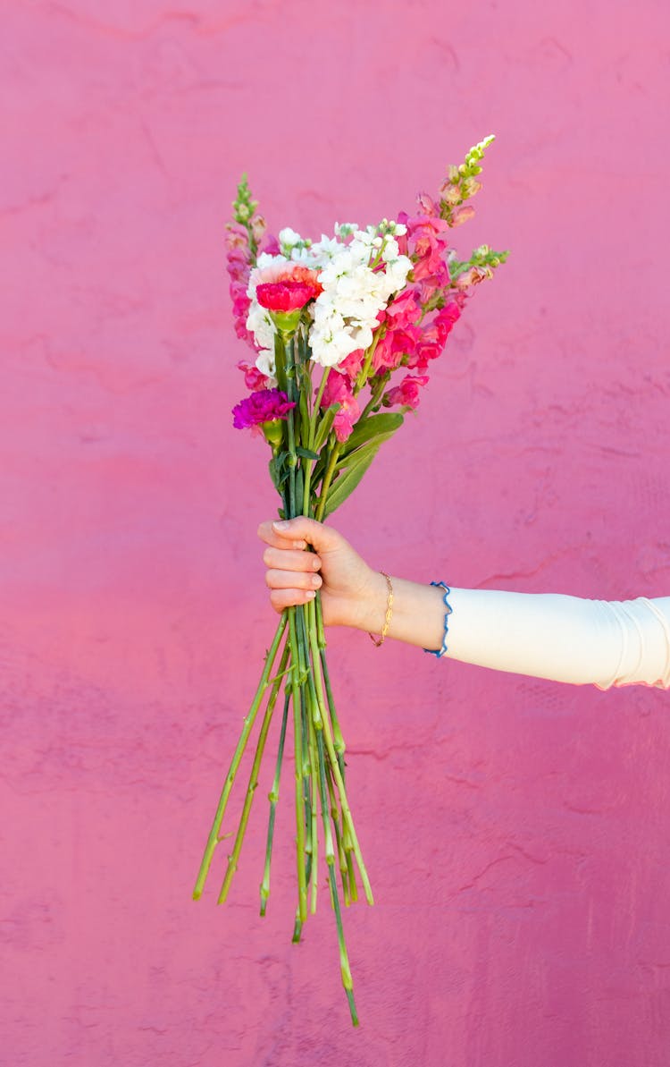 Woman Hand Holding Flowers