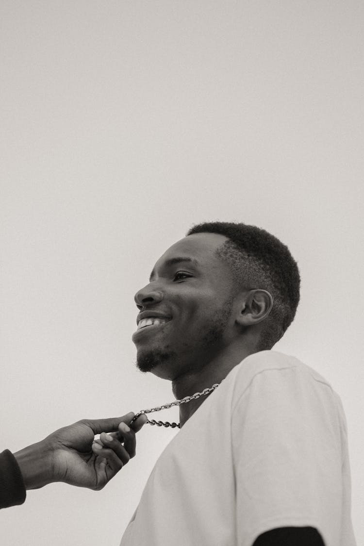 Smiling Young Man Outdoors On Sky Background