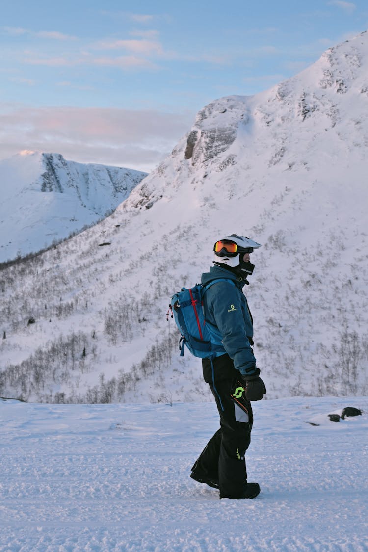 Man Hiking In High Mountains