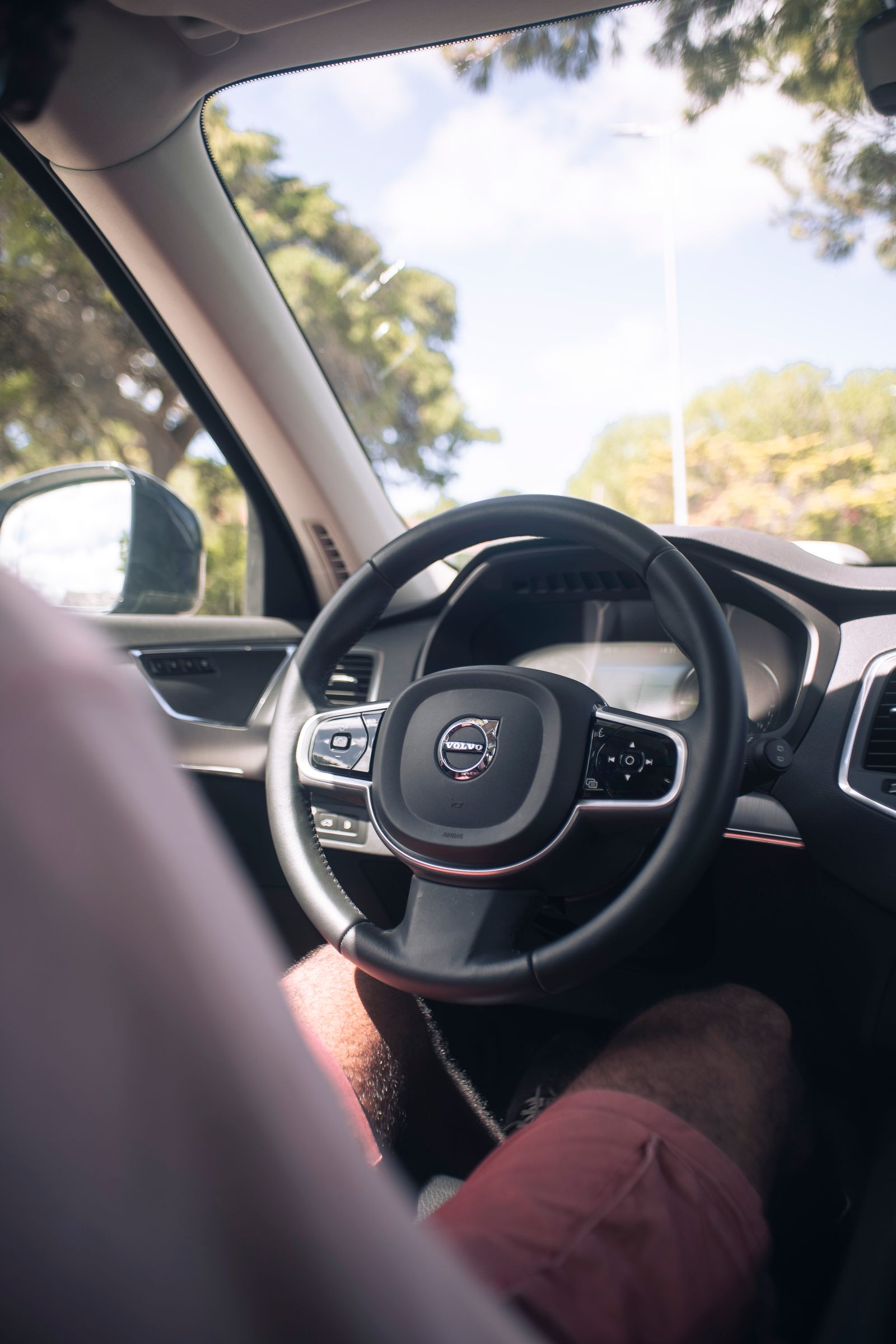 Close-up of a car steering wheel and dashboard