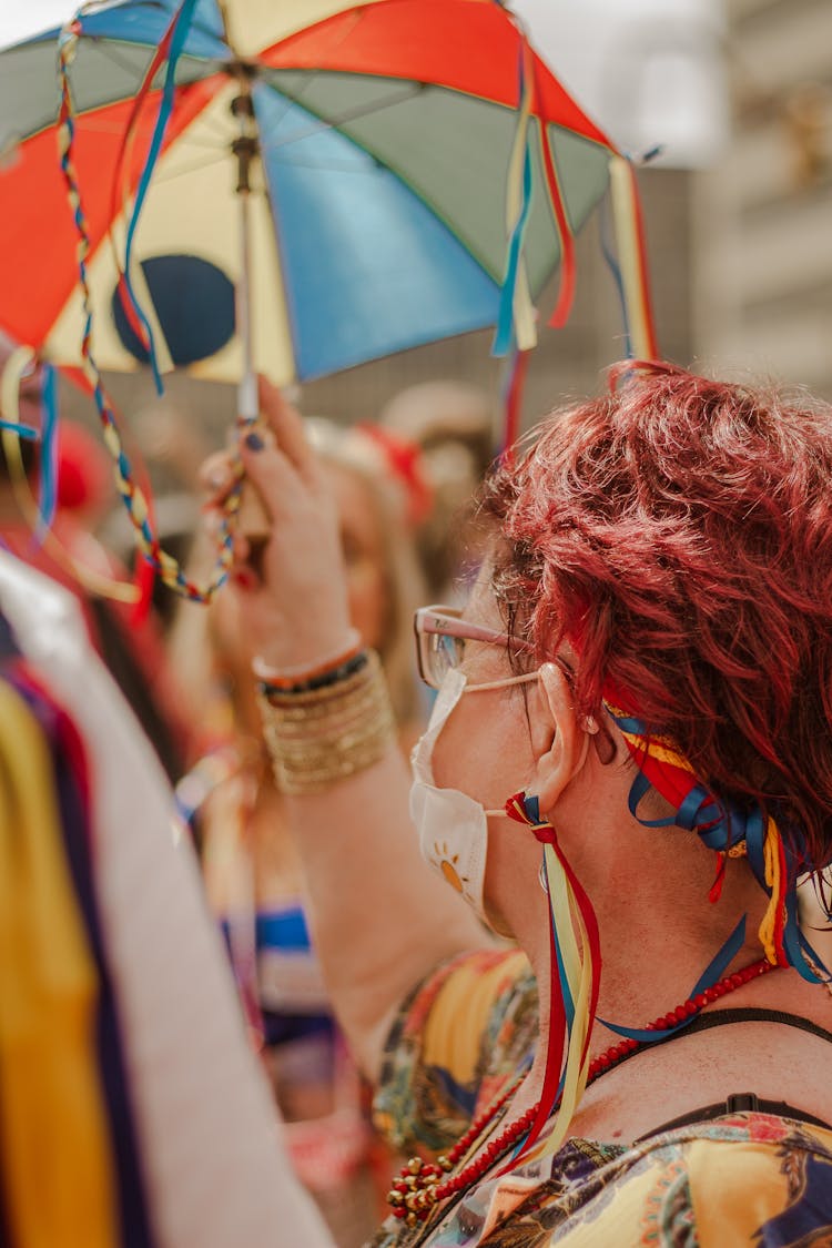 Woman With Colorful Umbrella On Street Festival