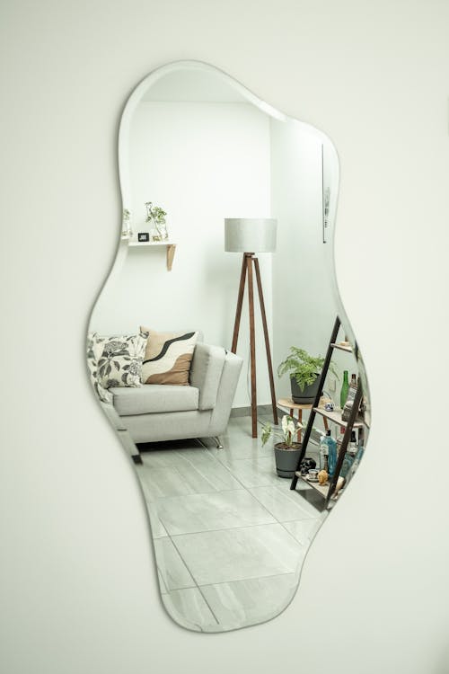 Interior Design Reflection in Mirror Hanging on Wall