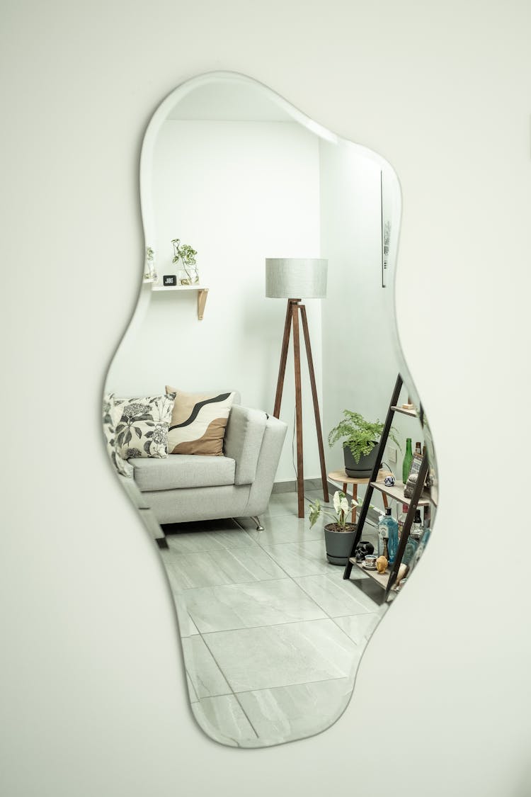 Interior Design Reflection In Mirror Hanging On Wall