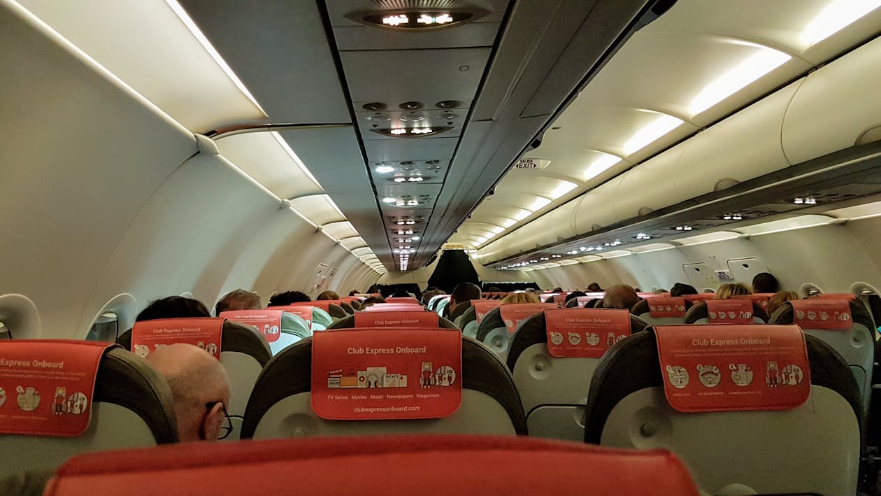 Free Interior of Airplane with Passengers Stock Photo