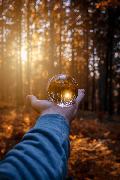 Free Person Holding Ball Glass Stock Photo