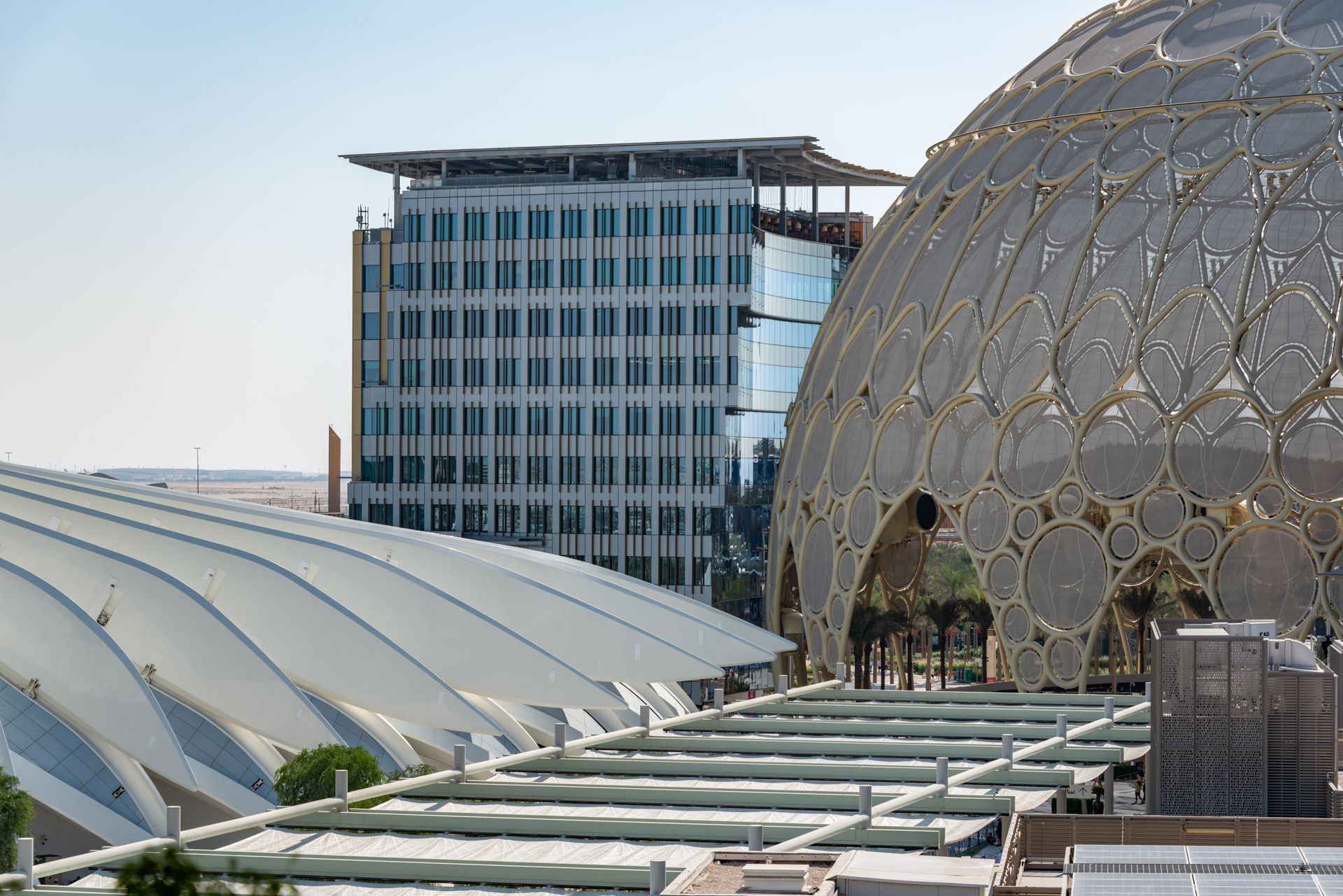 Showcasing modern architecture with a striking dome and glass facade.