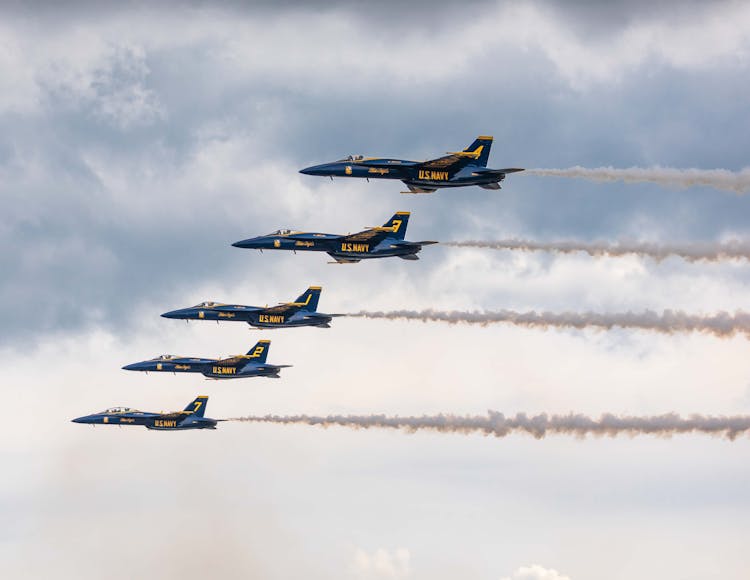 Military Airplanes Flying In Blue Sky