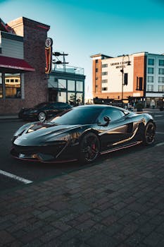 A modern sports car parked on city streets in Tacoma, Washington, showcasing urban architecture.