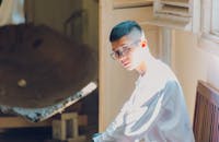 Man Wearing White Shirt Looking Down