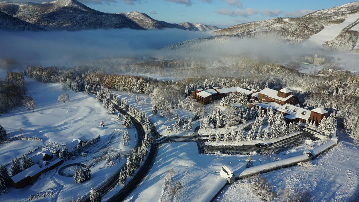 Aerial Photography Of Buildings Covered By Snow · Free Stock Photo