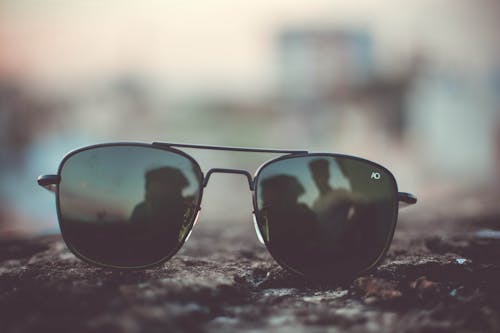 Focus Photo of Black Aviator-style Sunglasses on Surface
