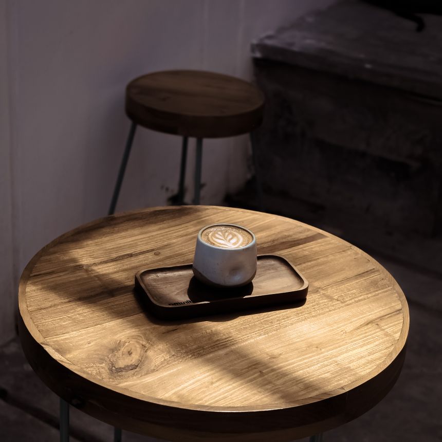 Cappuccino on a wooden table by Rivero on Pexels