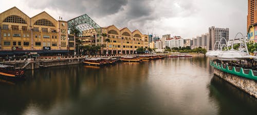 Clouds over River in Town