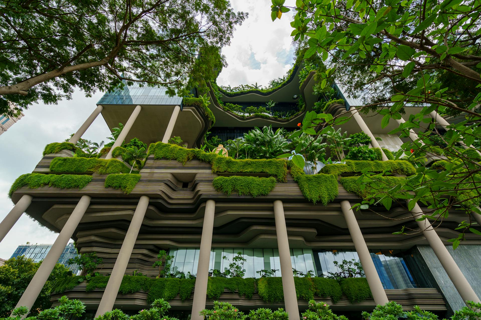 Lush green facades and innovative design on a Singapore building showcasing sustainable architecture.