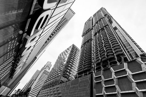 Free Striking black and white image of towering skyscrapers in Singapore's modern skyline. Stock Photo