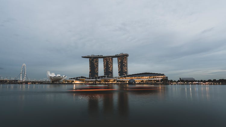 Illuminated Modern City Buildings Near Water