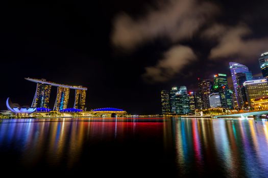 Experience the illuminated Singapore skyline with Marina Bay Sands at night.