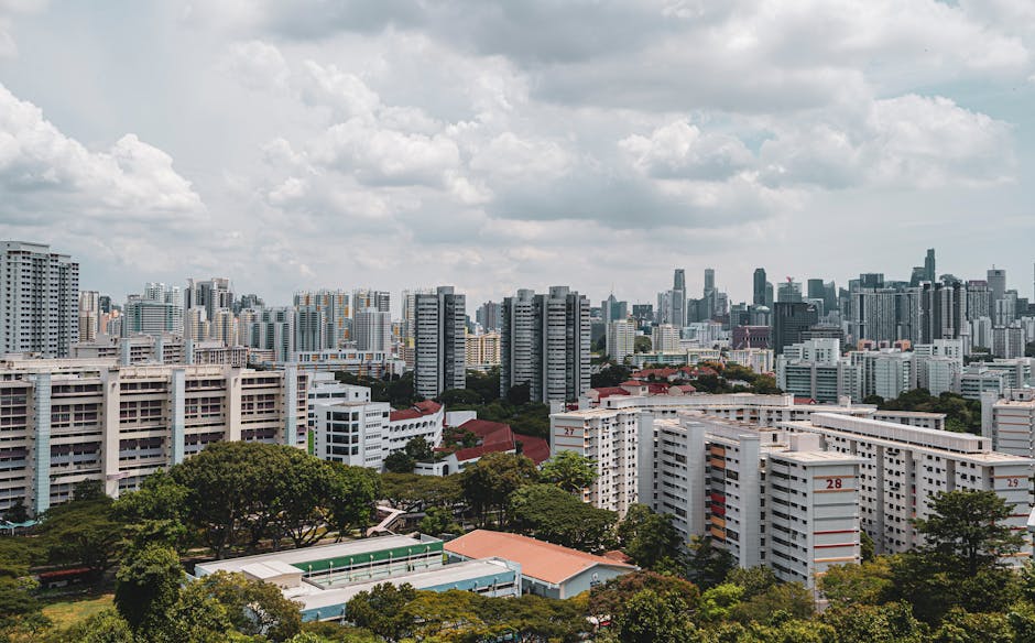 Stunning aerial view of a cityscape with dense skyscrapers and urban housing.
