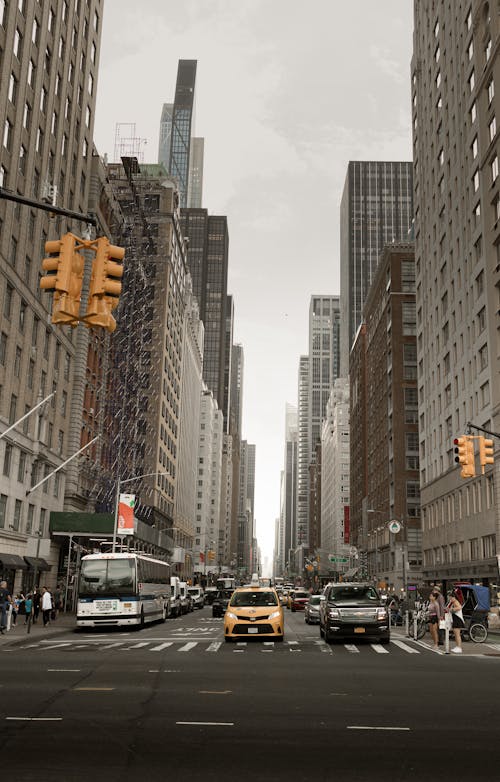 Free Yellow cab between buildings Stock Photo