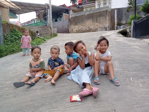 Free children playing happily on the street Stock Photo