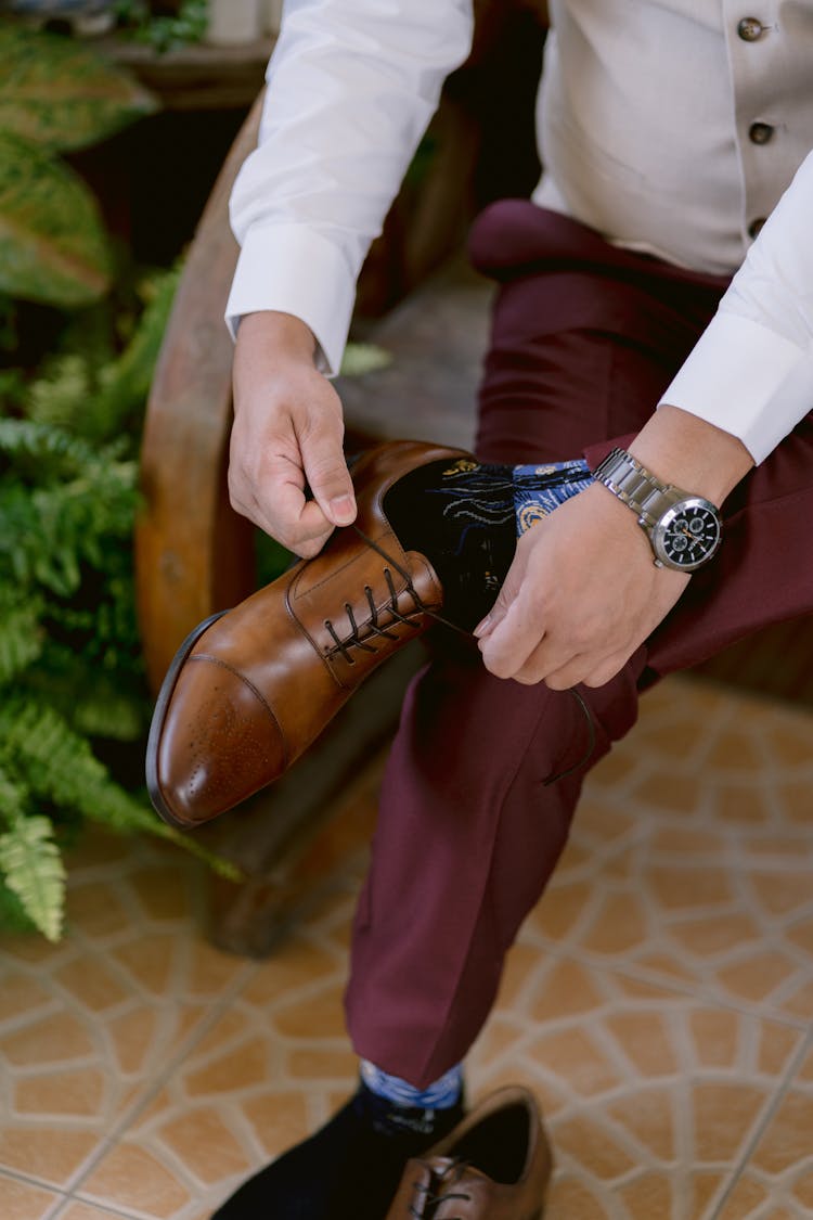 Stylish Man Tying Shoes