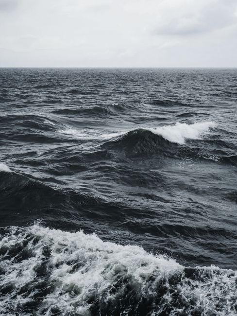 Captivating view of dark ocean waves rolling under overcast skies in Poland.