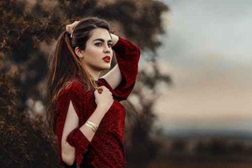 Beautiful Woman Wearing a Shiny Red Dress