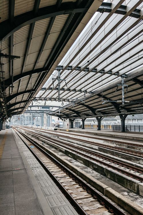 Free Empty train station in Bangkok showcasing rail tracks and urban architecture. Stock Photo