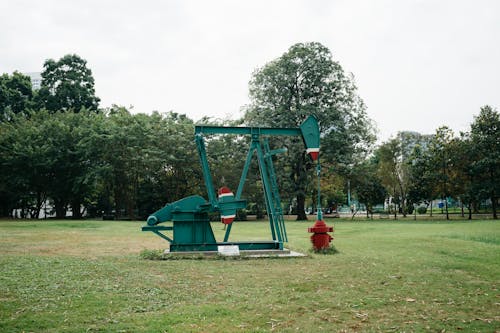 Green Pumpjack in the City Park