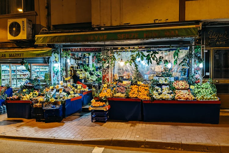 Illuminated Market Stall With Fresh Fruit And Vegetables 