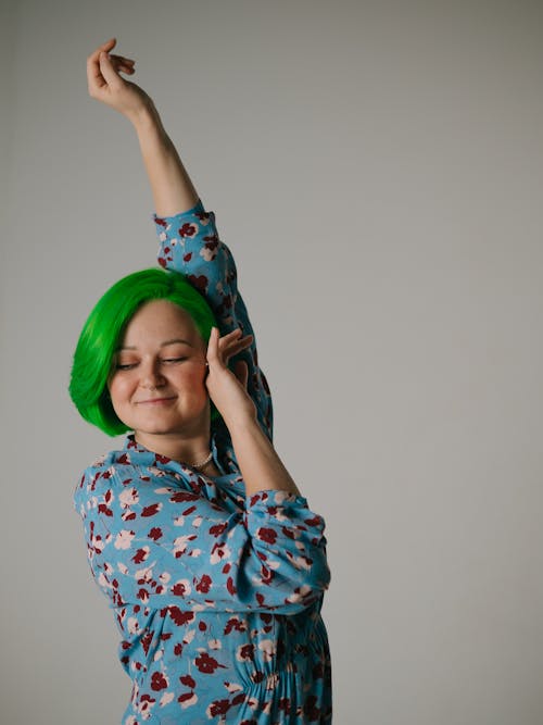 Woman Posing with Arm Raised