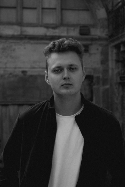 Free Stylish black and white portrait of a young man in Valletta, Malta. Stock Photo