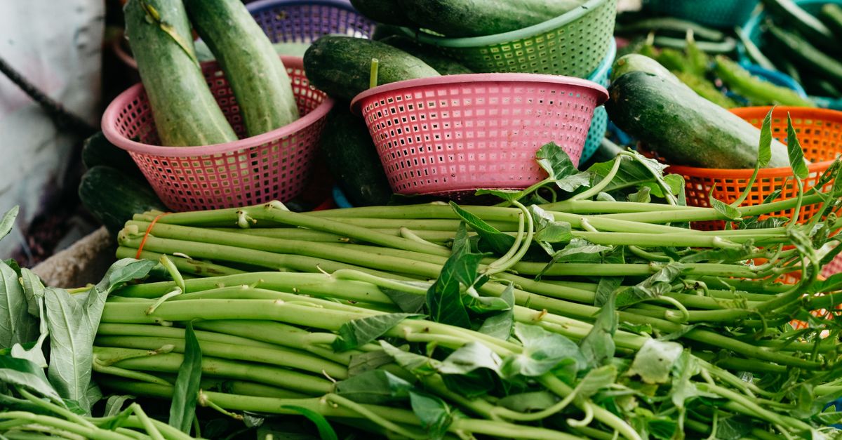 Photo by Markus Winkler Colorful display of fresh organic vegetables at a vibrant local market stall, perfect for healthy shopping imagery.