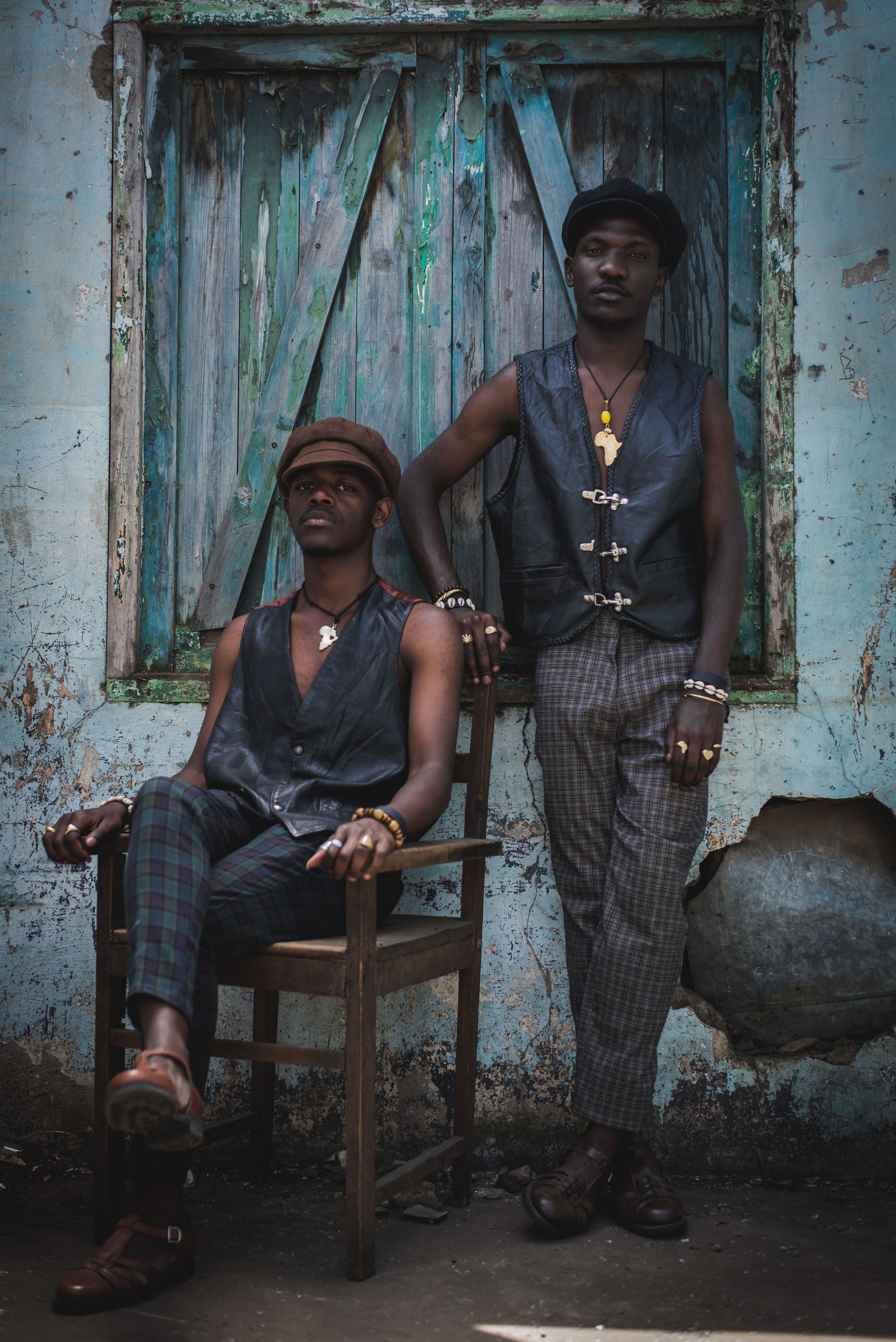 Elegant fashion shoot of two men in Nairobi, displaying vintage style.