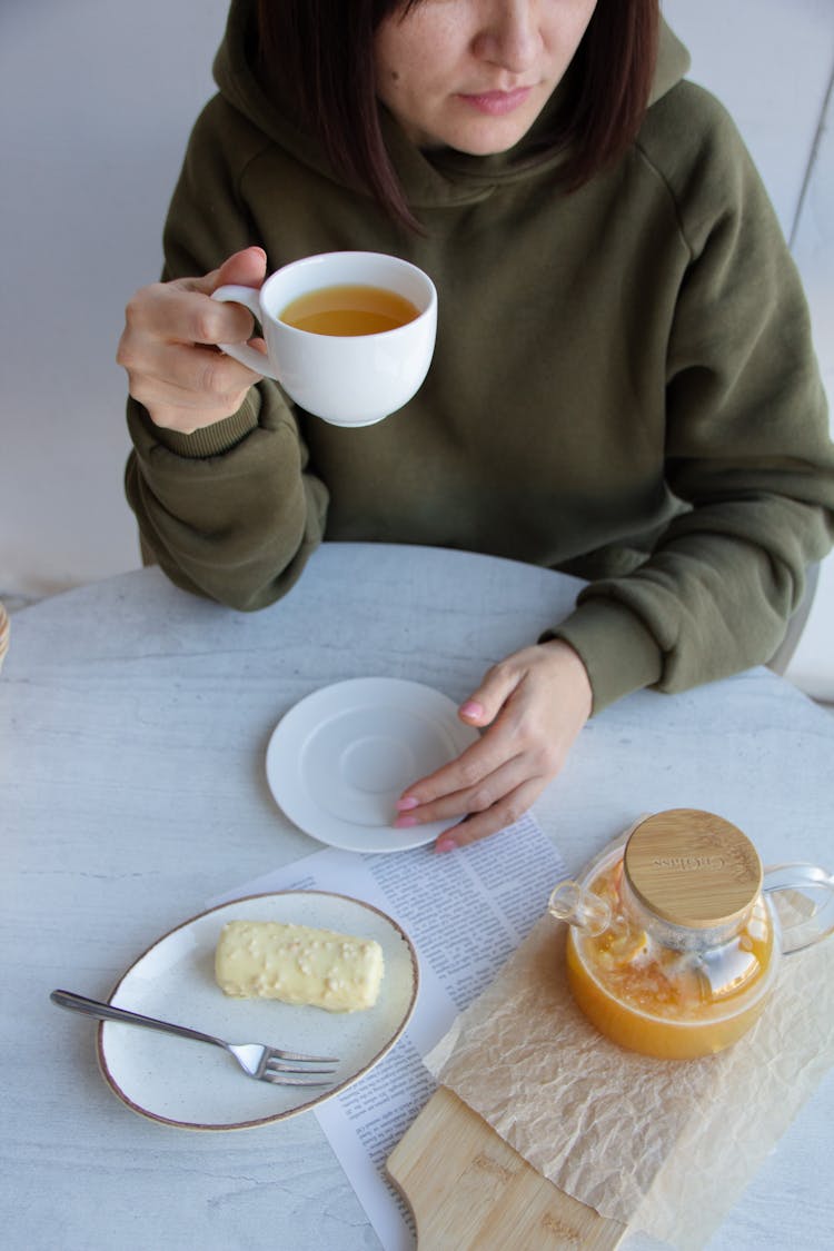 Woman Drinking From A Cup 