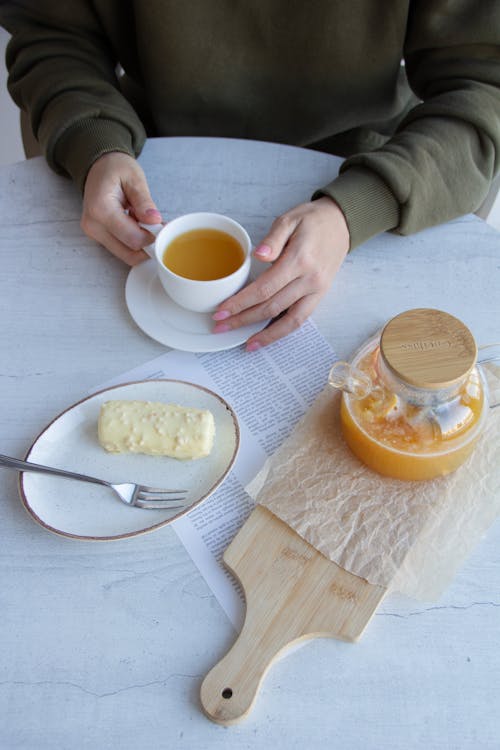 Hands Holding a Cup 