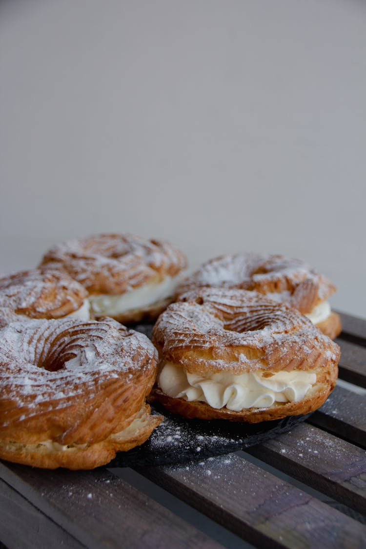 Doughnuts With Cream On Table