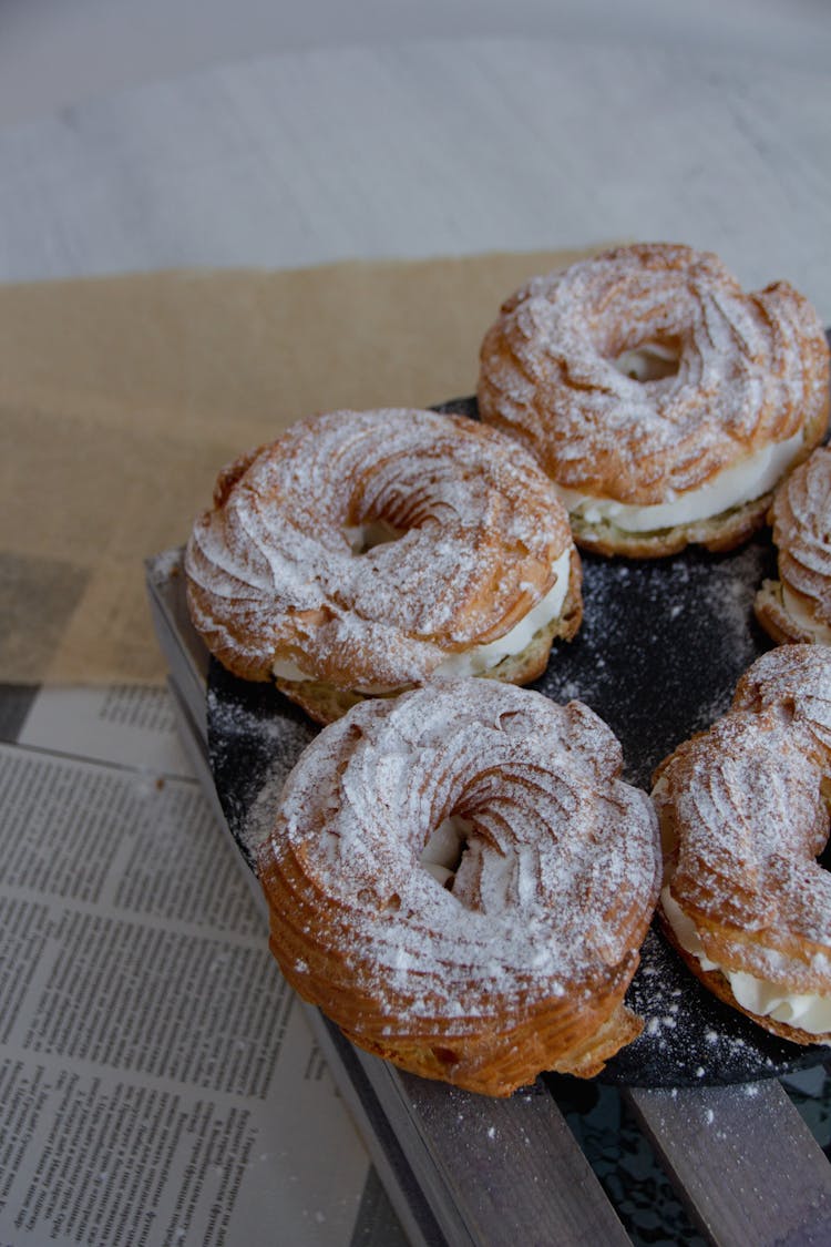 Doughnuts With Cream On Table