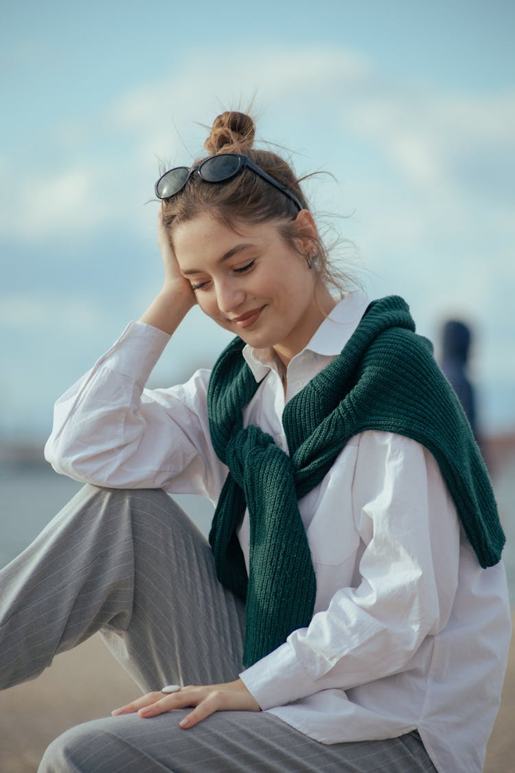 Woman In Blouse And Pants At Beach