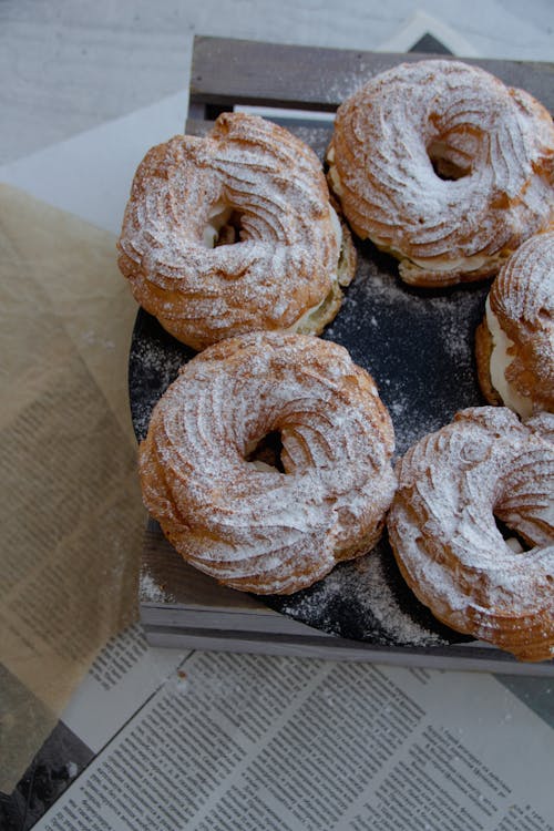 Doughnuts with Cream on Table